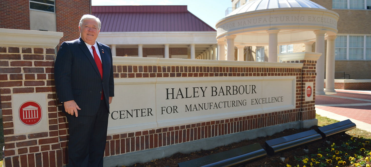 Haley Barbour in front of the Center for Manufacturing Excellence